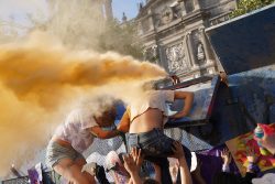 A police officer sprays an irritant smoke at demonstrators during a protest to mark International Women's Day in front of Mexico's National Palace in Mexico City, Mexico, on March 8.