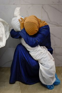 In a hospital in the southern Gaza Strip, a Palestinian woman cradles the body of a child killed in Israeli airstrikes on Oct. 17. Of the more than 10,000 Gazans reported killed in the first month of the war begun by the Oct. 7 massacre of Israelis by Hamas, more than 4,000 were children.